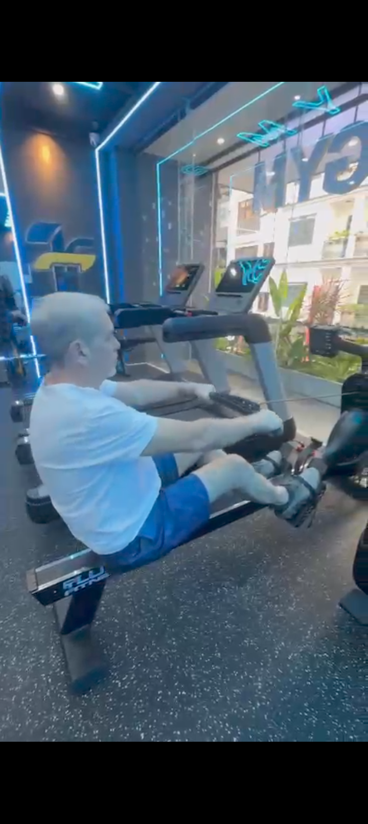 63 year old man doing lat pulldown exercise in gym, shoulder training after 60