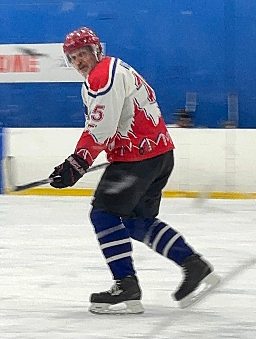 Man wearing number 15 jersey skating competitively in a hockey game at 63 — real proof that active engagement unlocks hidden physical reserves that passive rest never reveals.